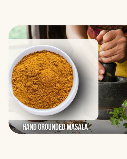 Hand-ground masala spice in a bowl with a pestle and mortar.
